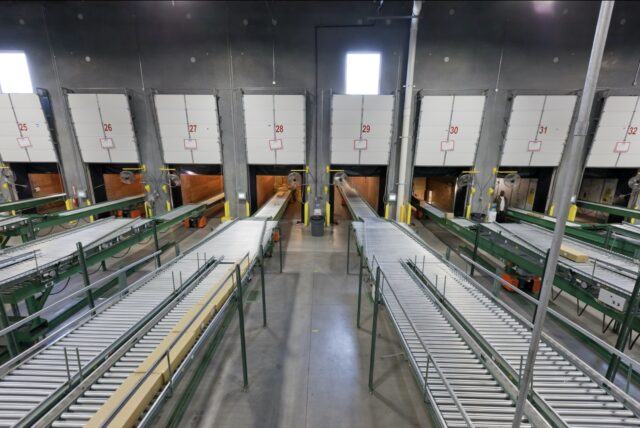 rigid two stage truck loaders in distribution center from above