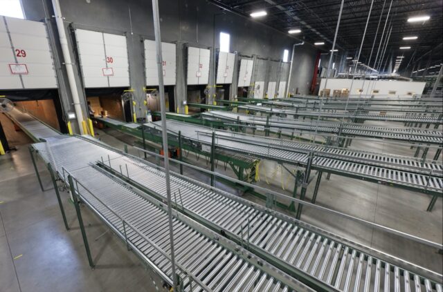 rigid two stage truck loaders in distribution center from side