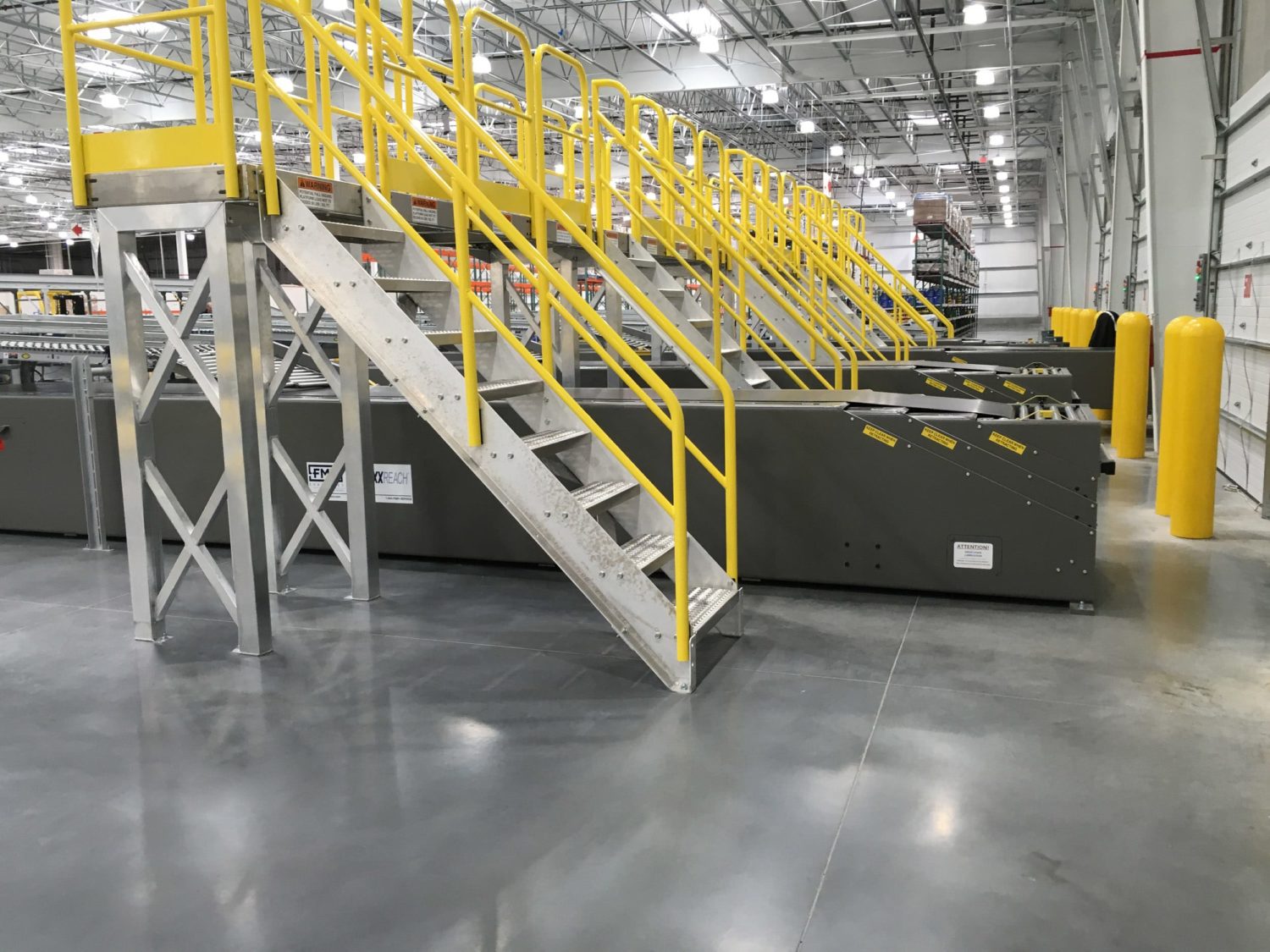 Close-up of FMH Conveyors equipment designed for handling packages in retail stores.